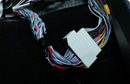 Beat-Sonic Encore Sigma plug and play harness with its factory style connector, shown in the vehicle