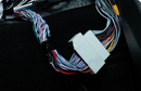 Beat-Sonic Encore Sigma plug and play harness with its factory style connector, shown in the vehicle