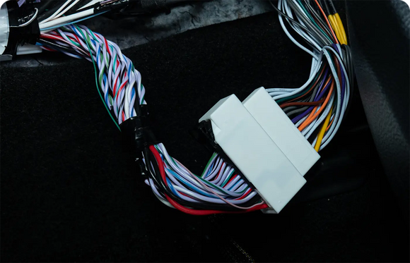 Beat-Sonic Encore Sigma plug and play harness with its factory style connector, shown in the vehicle